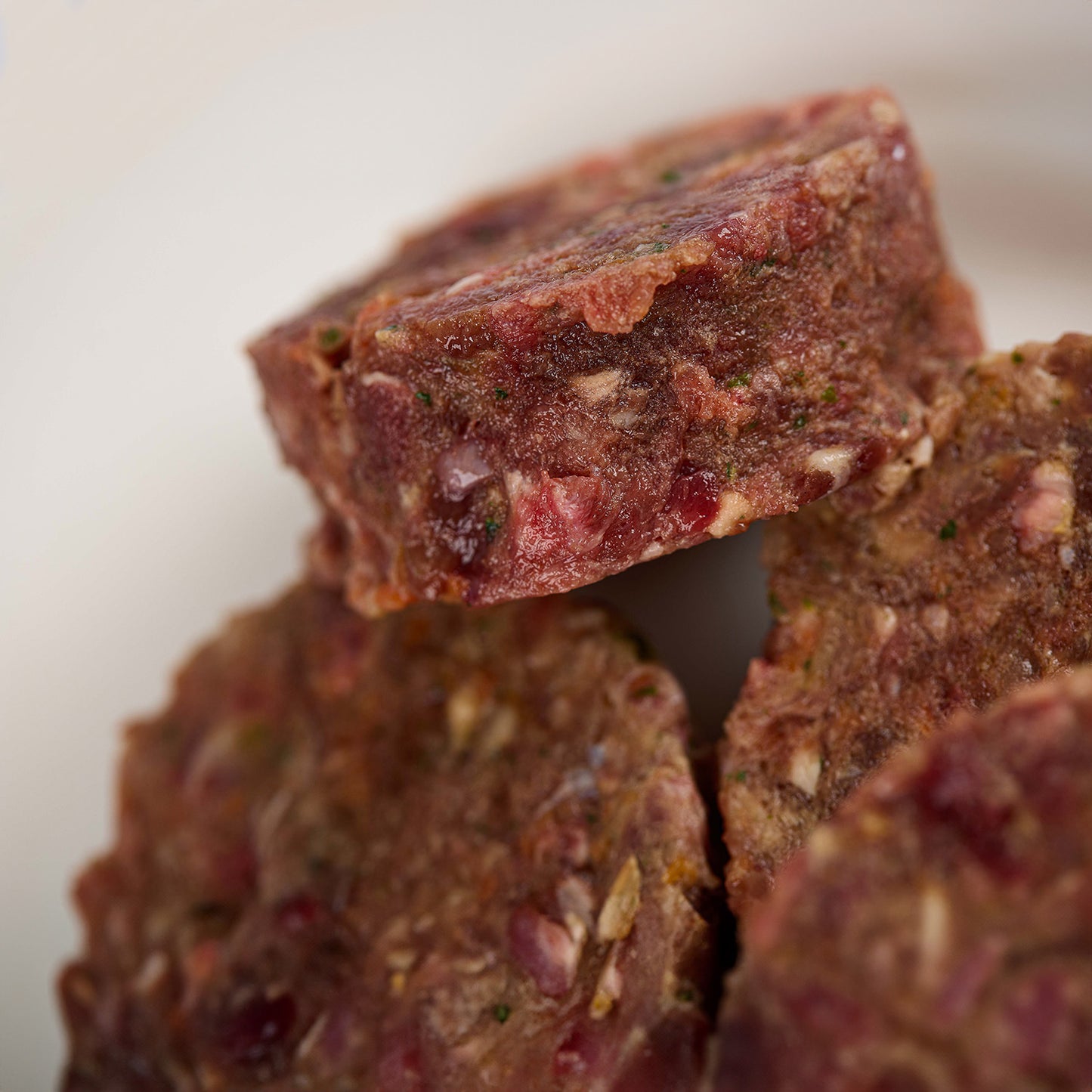 Close up of Tender Beef raw dog food patties from LUNA & me