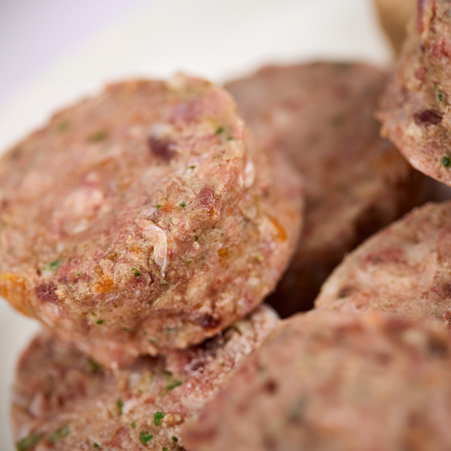 Close up of turkey raw dog food patties from LUNA & me