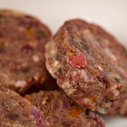 Close up of lamb & turkey raw dog food patties from LUNA & me