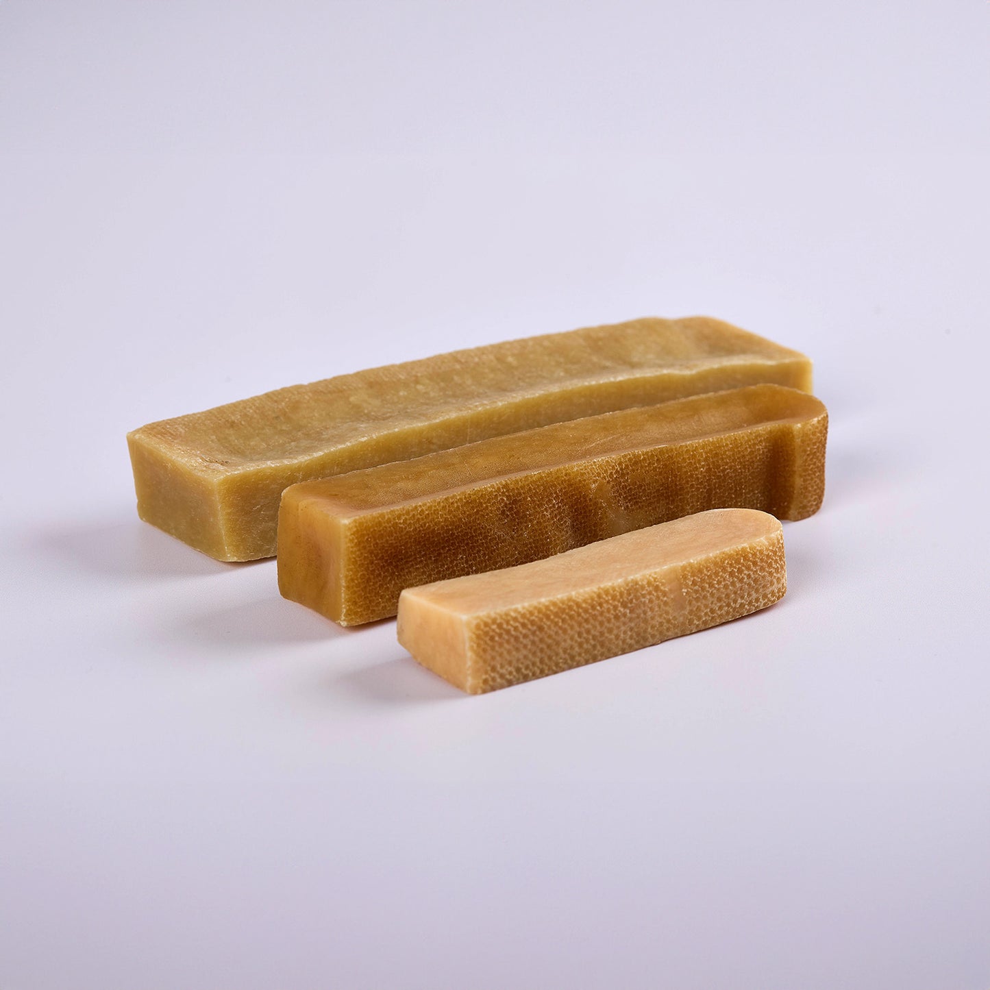 Three yakers dog chews in varying sizes made of Himalayan Yak milk